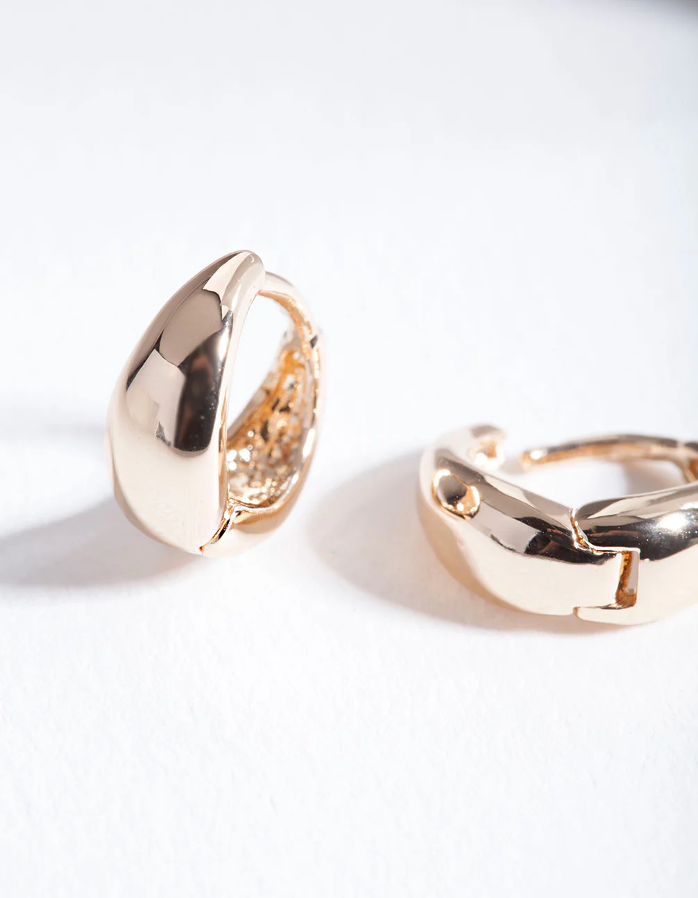 Gold Polished Chunky Huggie Earrings - Image 3
