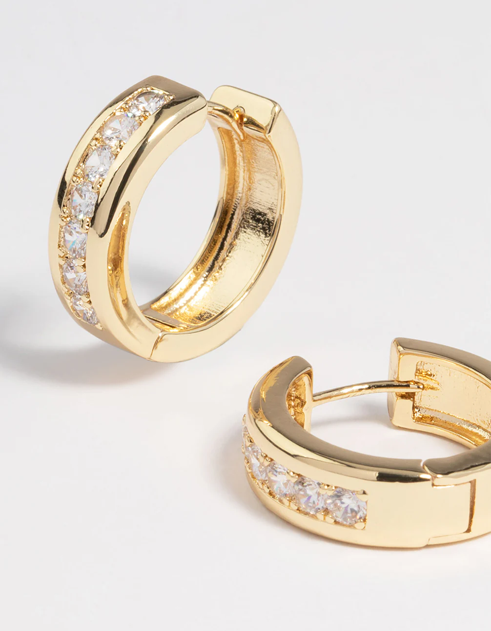 Gold Plated Cubic Zirconia Encased Huggie Earrings - Image 2