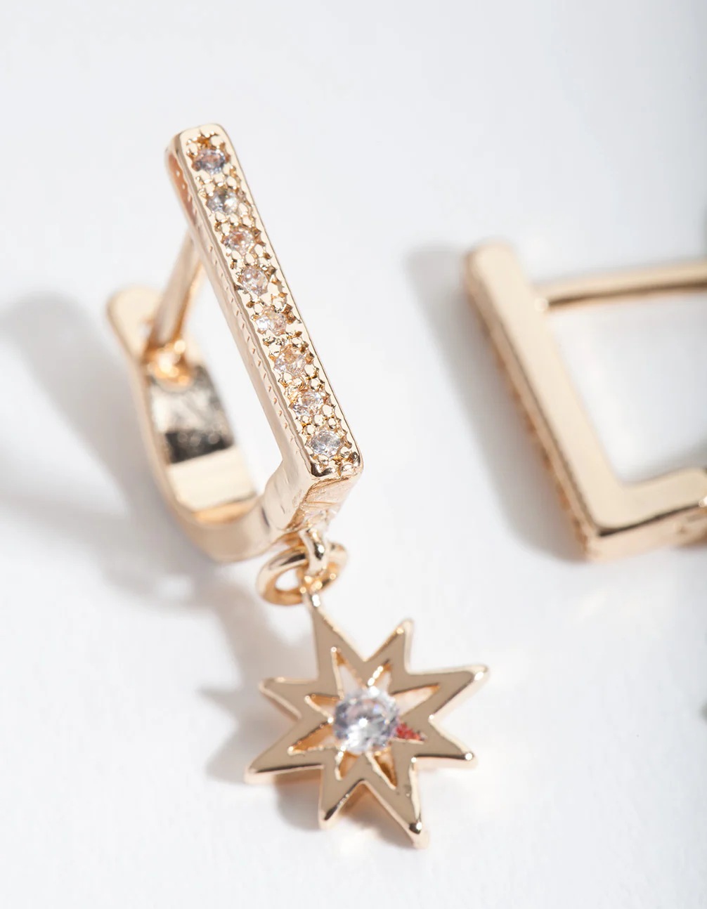 Gold Starburst Huggie Earrings - Image 2