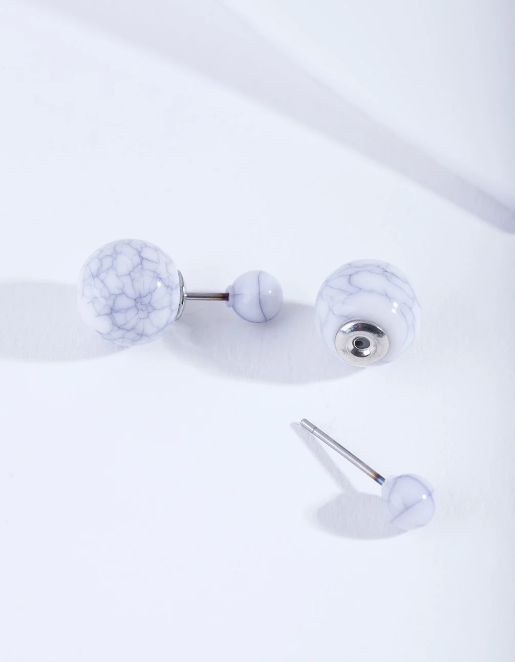 White Cracked Ball Earrings - Image 2