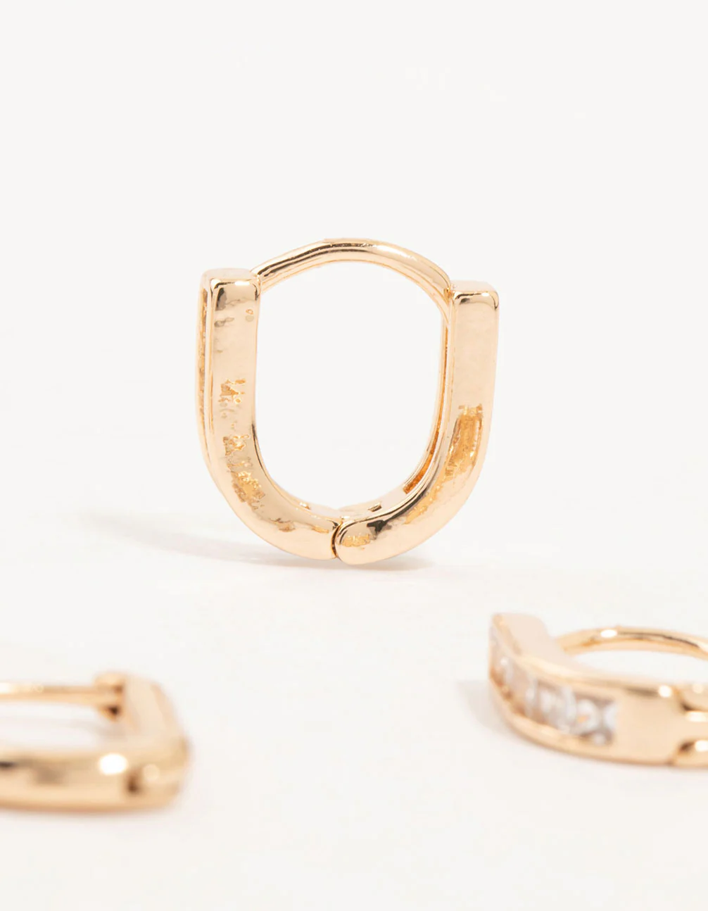 Gold Cubic Zirconia Oval Huggie Earrings 3-Pack - Image 3