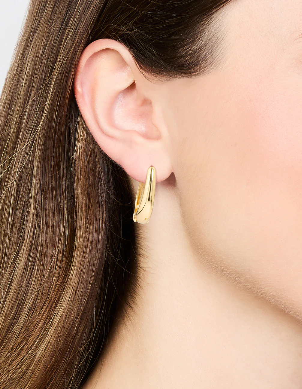 Gold Oval Huggie Earrings - Image 2