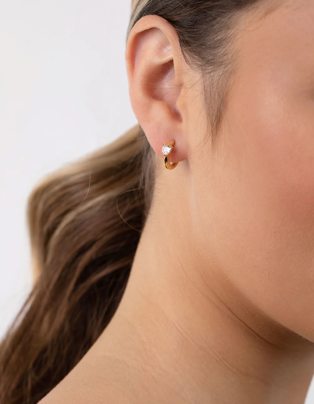 Sterling Silver Gold Cubic Zirconia Heart Huggie Earrings - Image 2