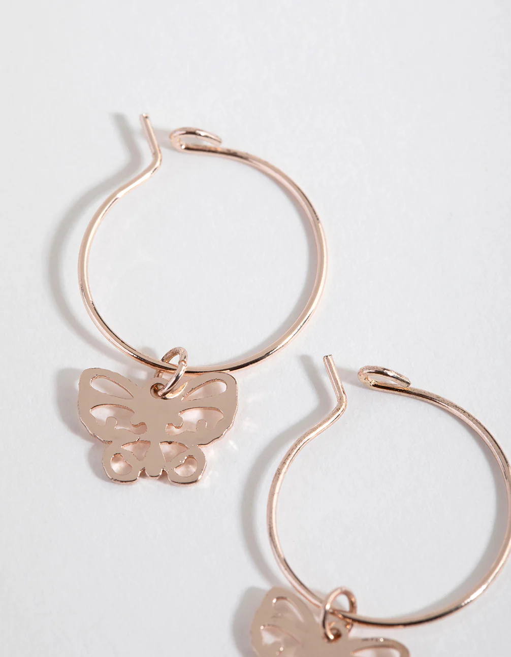 Rose Gold Cut Out Butterfly Huggie Earrings - Image 2