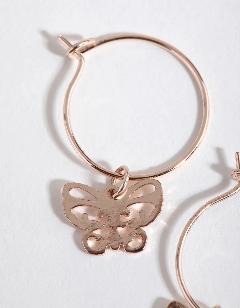 Rose Gold Cut Out Butterfly Huggie Earrings - Image 3