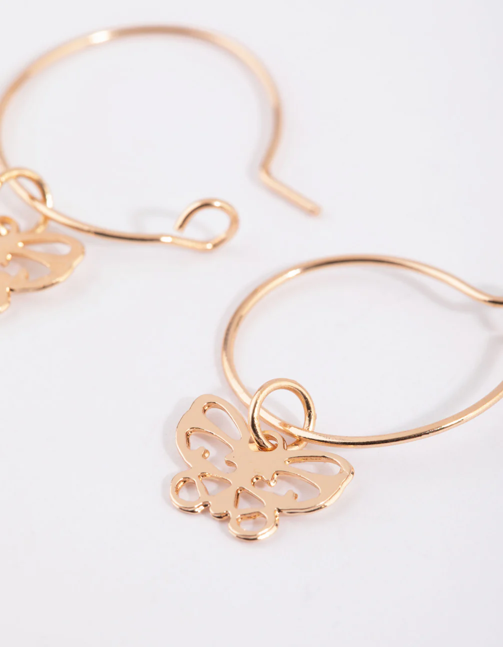 Gold Cut Out Butterfly Huggie Earrings - Image 3