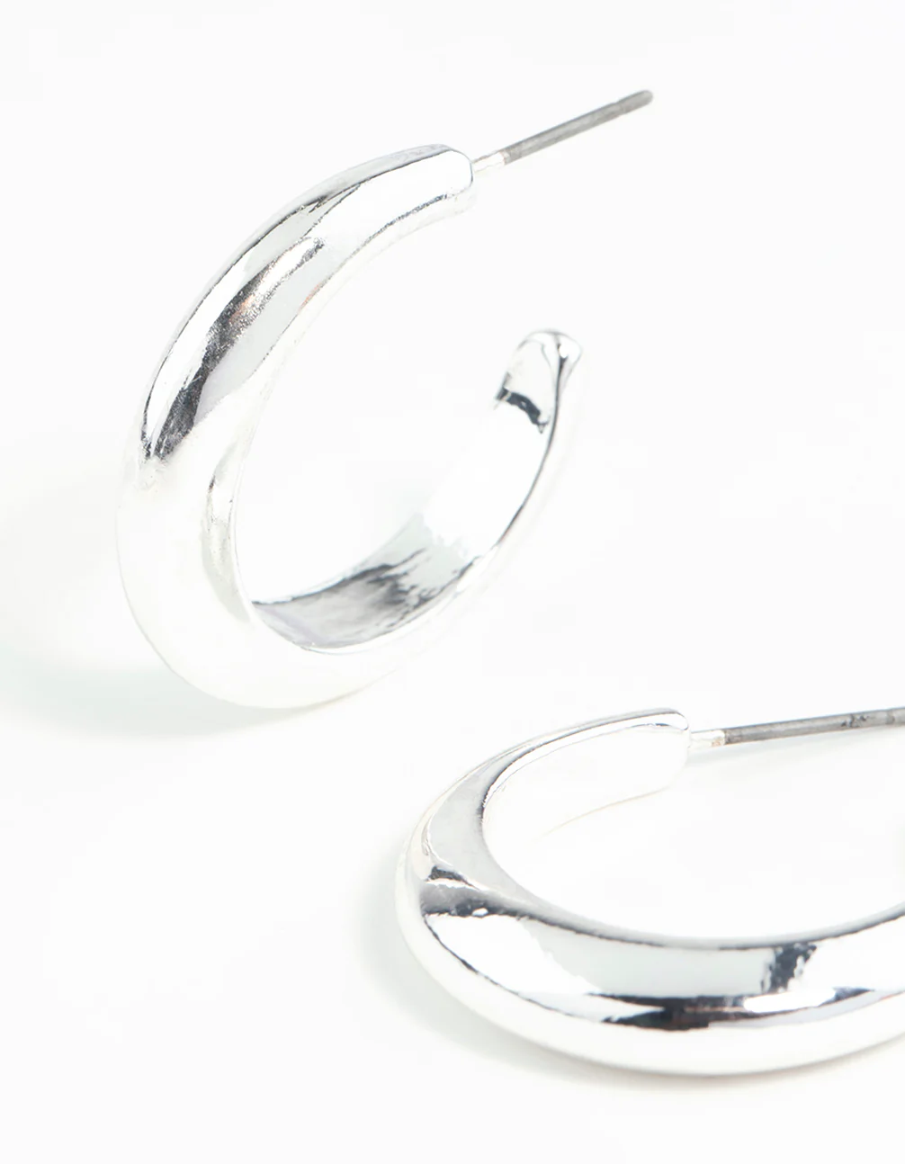 Silver Rounded Hollow Huggie Earrings - Image 2