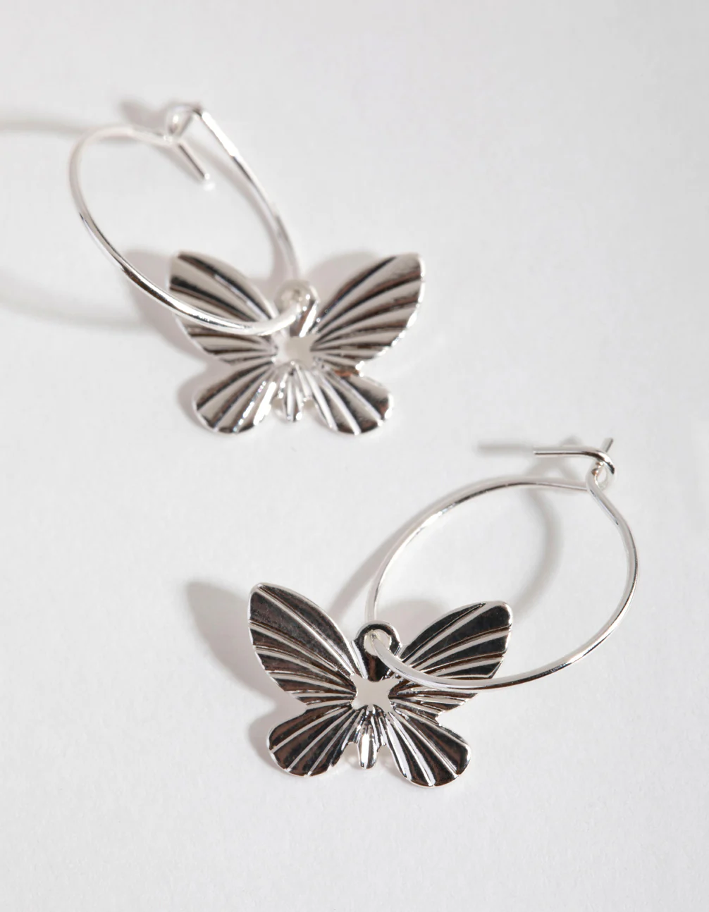 Silver Butterfly Huggie Hoop Earrings - Image 2