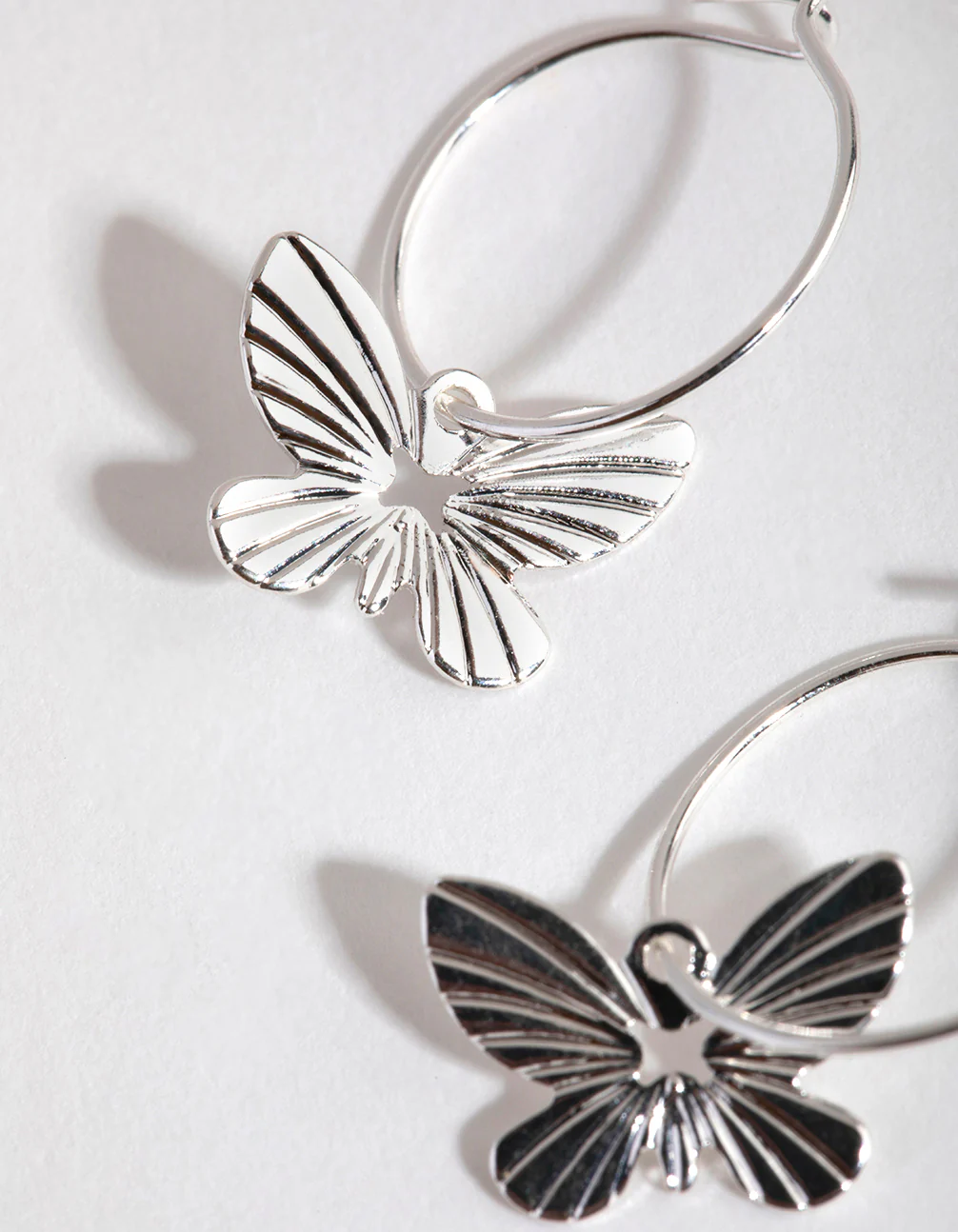 Silver Butterfly Huggie Hoop Earrings - Image 3