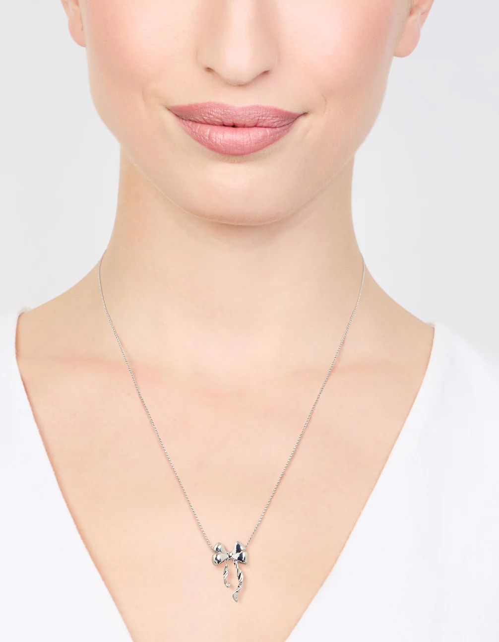 Silver Bow Twirl Pendant Necklace - Image 2