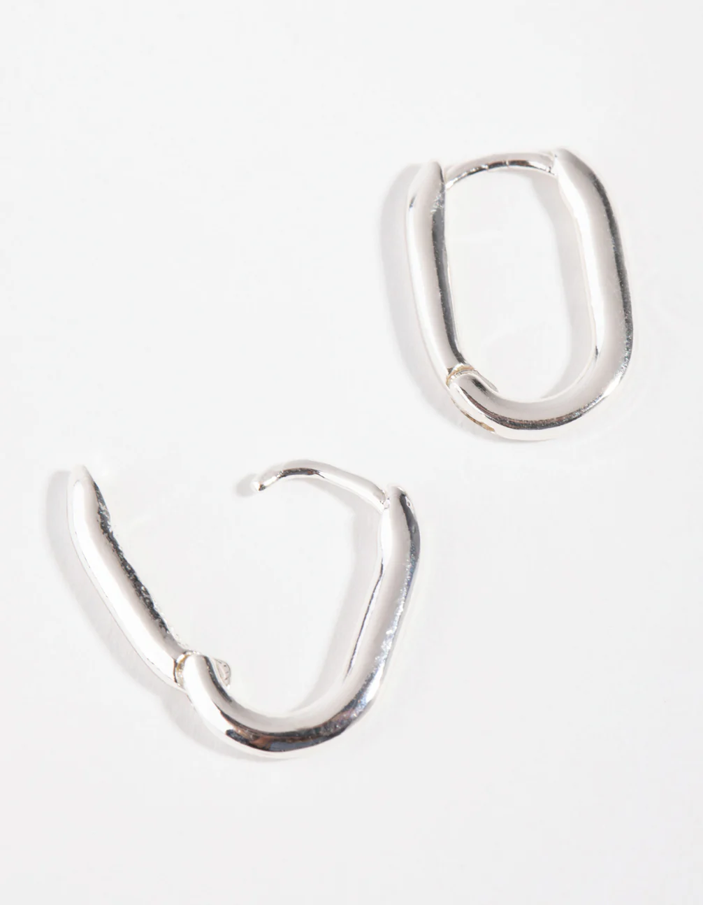 Sterling Silver Sleek Oval Huggie Earrings - Image 2