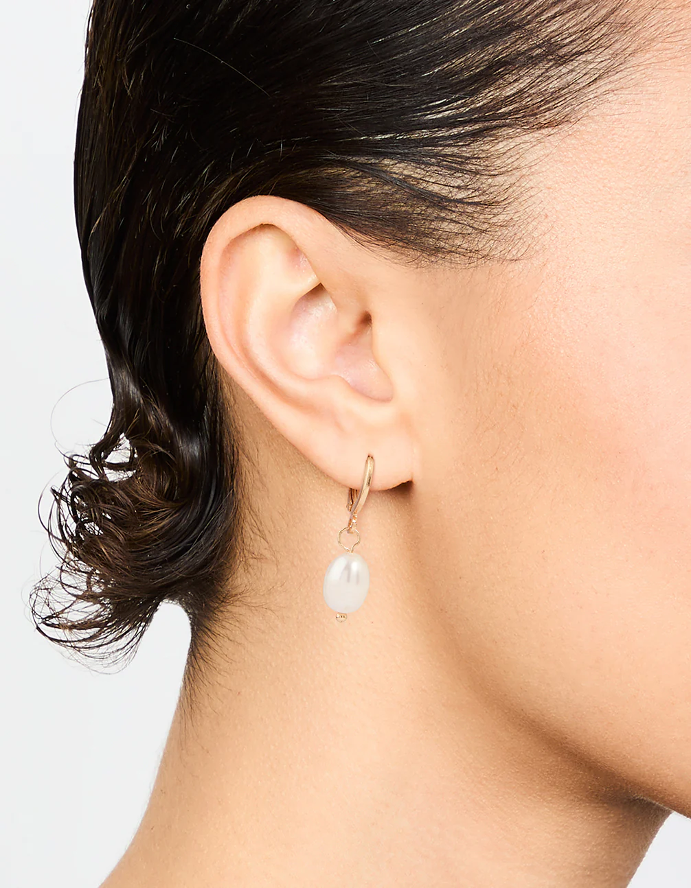 Gold Pearl Huggie Earrings - Image 2