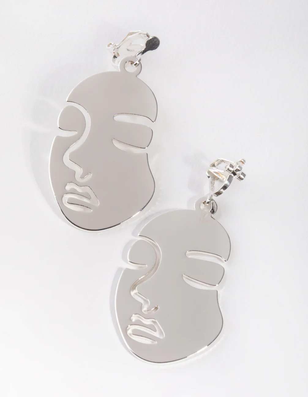 Silver Cutout Face Clip Earrings - Image 2